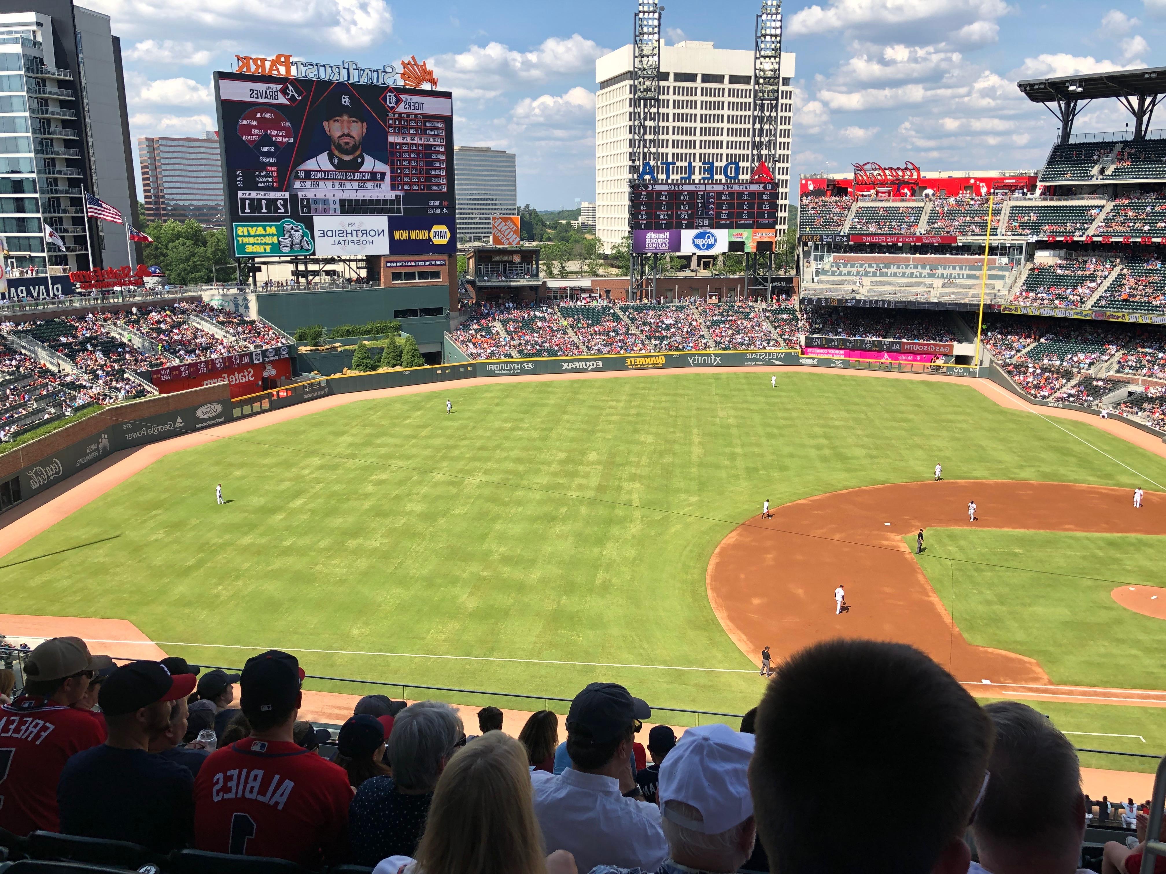 A sideline view of a sunny baseball field